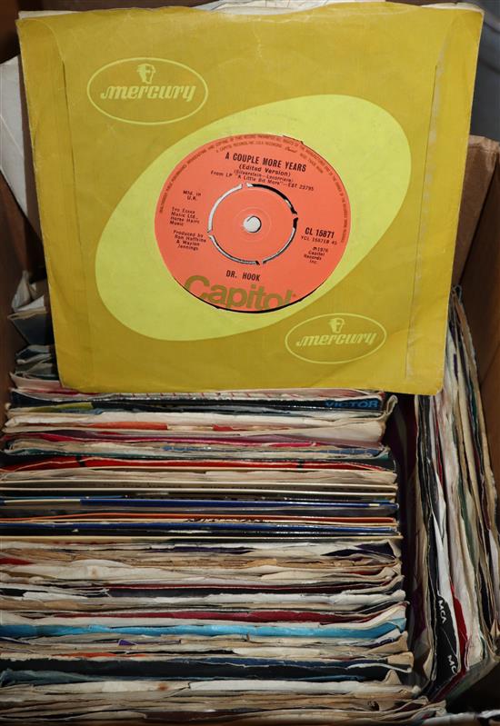 A collection of 1950s and later 45rpm vinyl single records, including Beatles, T-Rex, etc.